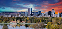 Greater Denver skyline with trees and a lake