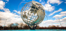 a large globe sculpture in a park in New York East