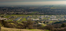 Aerial View of Solano Valley with trees, buildings, and houses
